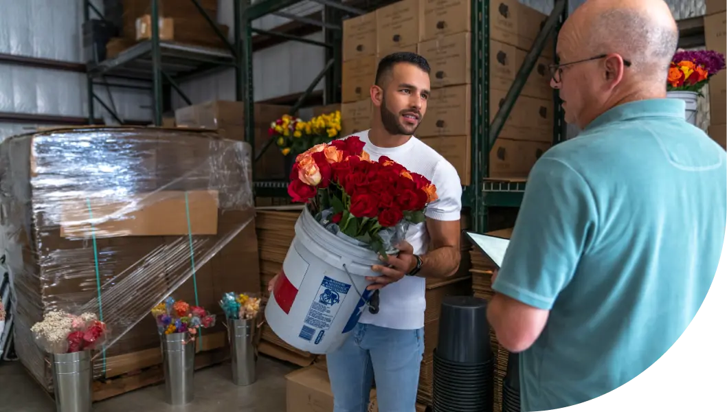 Flower shop owner giving a testimonial about Gfiber internet service to a Gfiber representative.